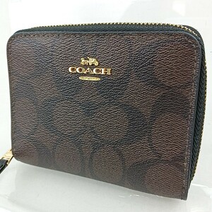 A Φ【商品ランク:B】 コーチ COACH シグネチャー 総柄 ロゴメタル ゴールド金具 レザー ラウンドファスナー 財布 ミニウォレット 茶系