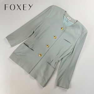 FOXEY フォクシー セレモニーノーカラージャケット 金ボタン 総裏 ウエストタック レディース 水色 ライトブルー サイズ38*QB329