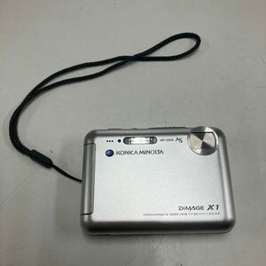 2405-3055 KONICA MINOLTA DiMAGE X1 コンパクトカメラ 本体のみ バッテリー切れの為動作未確認 ジャンク キズあり 60サイズ梱包予定