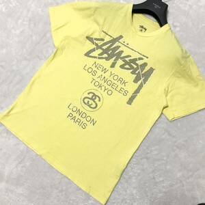 STUSSY ステューシー Tシャツ 半袖シャツ サイズMクルーネック イエロー カットソー ワールドツアー プリント ロゴ メンズ トップス