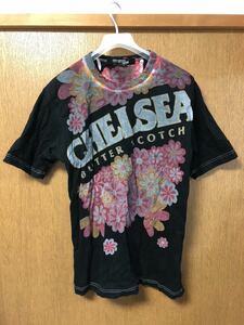 JUNYA WATANABE MAN コムデギャルソン ジュンヤワタナベマン 明治 Meiji CHEALSEA チェルシー キャンディ ロゴ 後染め Tシャツ HOMME PLUS