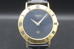 GUCCI Ref:3000M グッチ ゴールドカラー 黒文字盤 ローマ クォーツ レディース 腕時計 ■24489