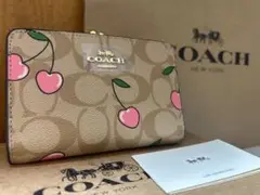 62 新品未使用 coach コーチ 二つ折り財布 がま口 チェリー シグネチャ