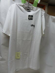 244－23　　テーシャッSTUSSY　Ｌｓａｉｚ白後ろプリントの絵がしてあります。未使用汚れ傷あります