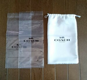 COACH コーチ 保存袋 透明パッケージ 長財布用 保存袋size約25×15㎝ 巾着 シワ折目の跡あり 財布 レディース/メンズ/ショップ袋