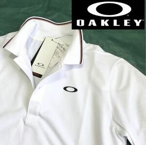 ♯C057新品【日本Lサイズ】白 ゴルフ オークリー Enhance SS Polo Essential 12.0ポロシャツ 半袖 吸汗速乾 総柄 OAKLEY